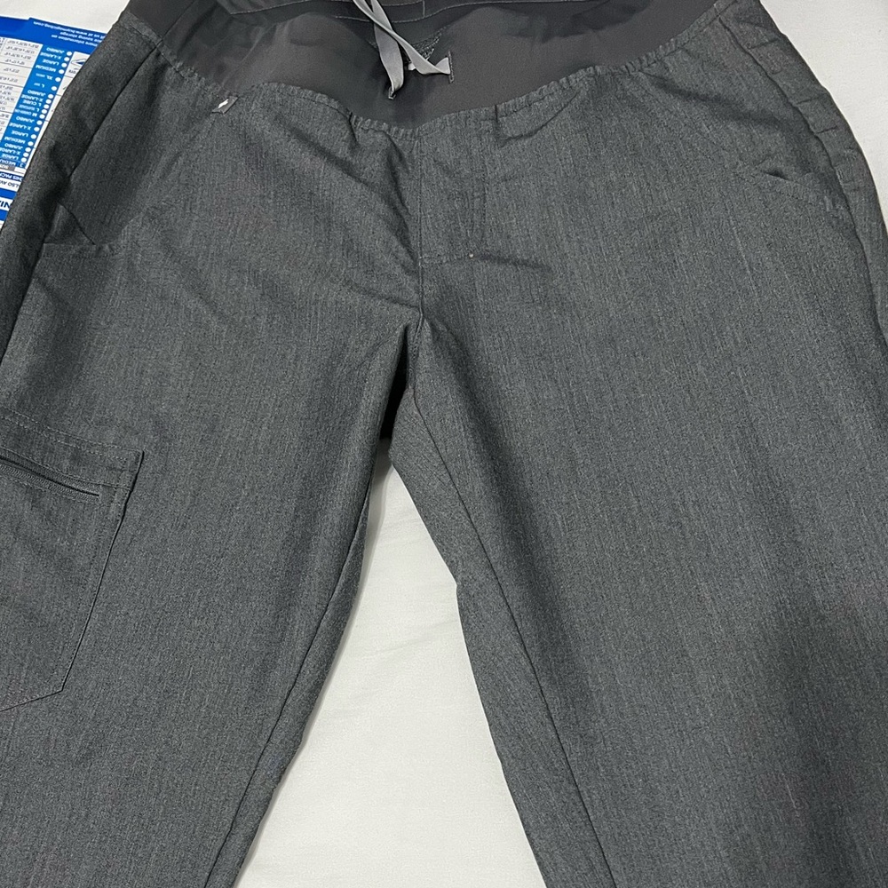 Gray jogger pants used. With bleach stain